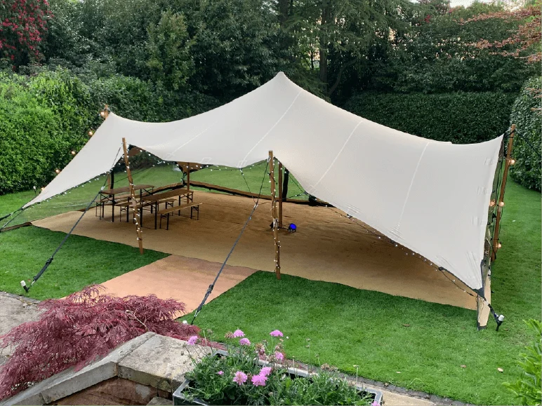 Stretch canopy covering a garden terrace