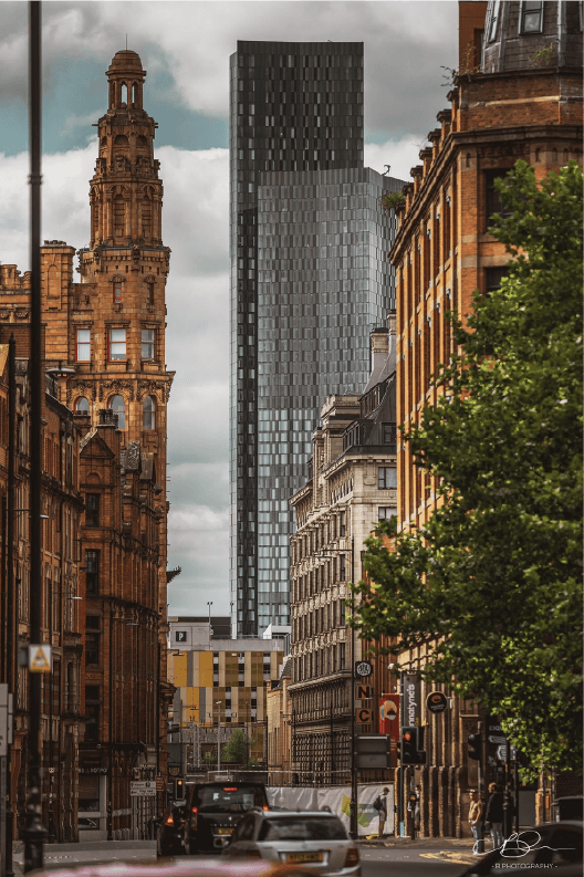 City street with historic buildings and a modern tower