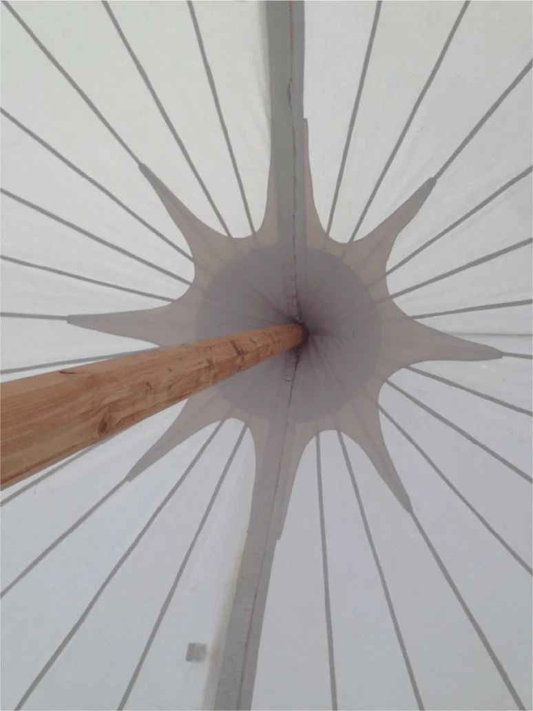 View up at a marquee roof and supporting pole