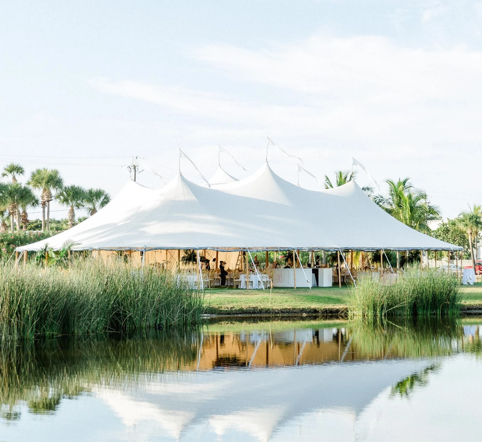 White sailcloth marquee beside a lake — example for events in Hale