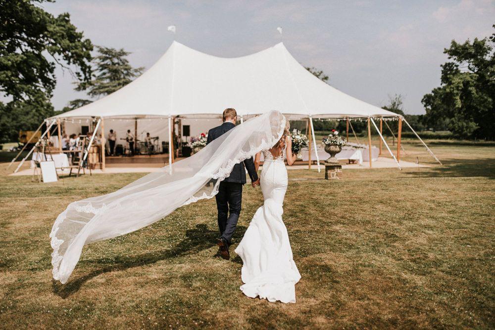 Wedding couple outside a white marquee — example for events in Bowdon