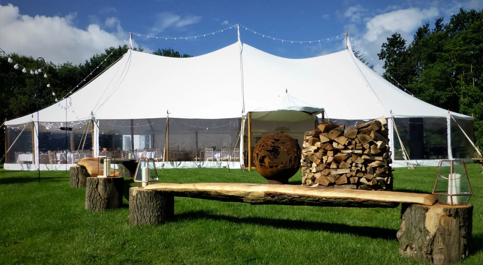 White marquee with a rustic bench outside — example for events in Bowdon