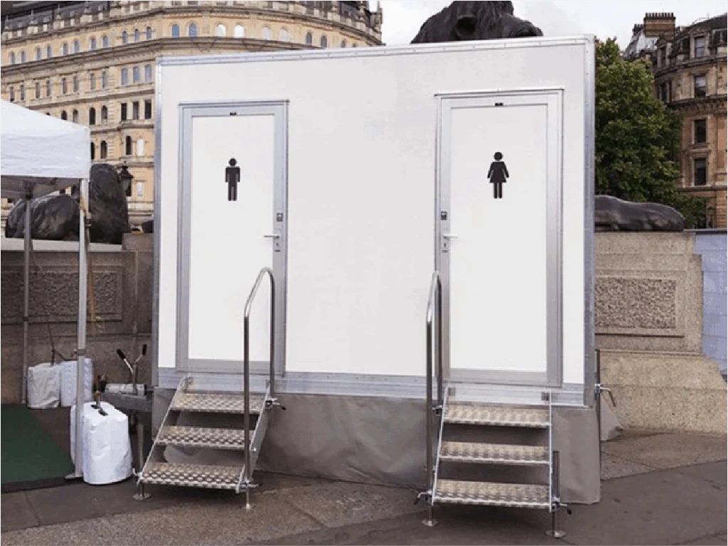 White mobile toilet unit with separate entrances