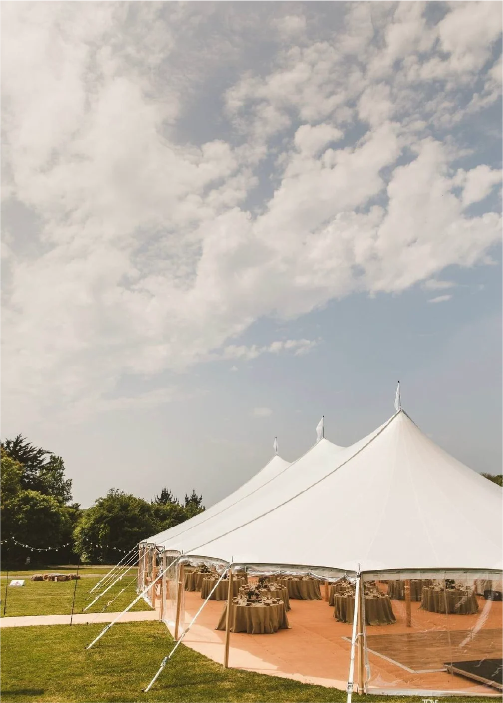 White marquee beneath a cloudy sky — example for events in Lancashire