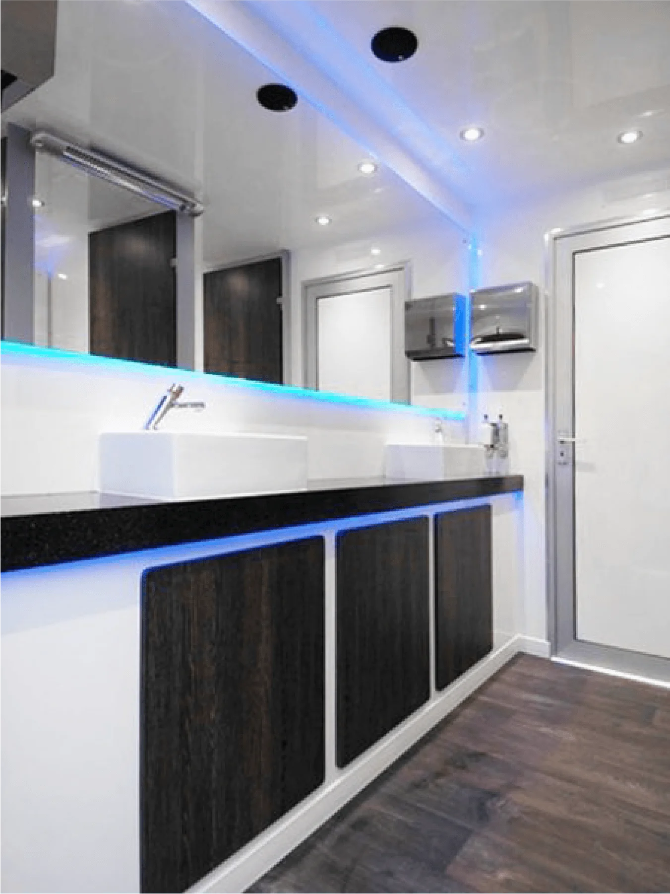 Luxury toilet interior with mirrors and washbasins