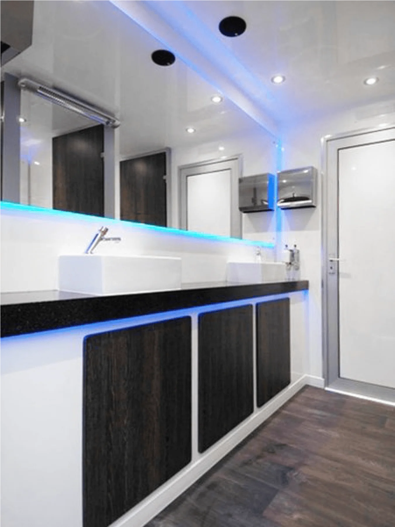 Luxury toilet interior with mirrors and washbasins