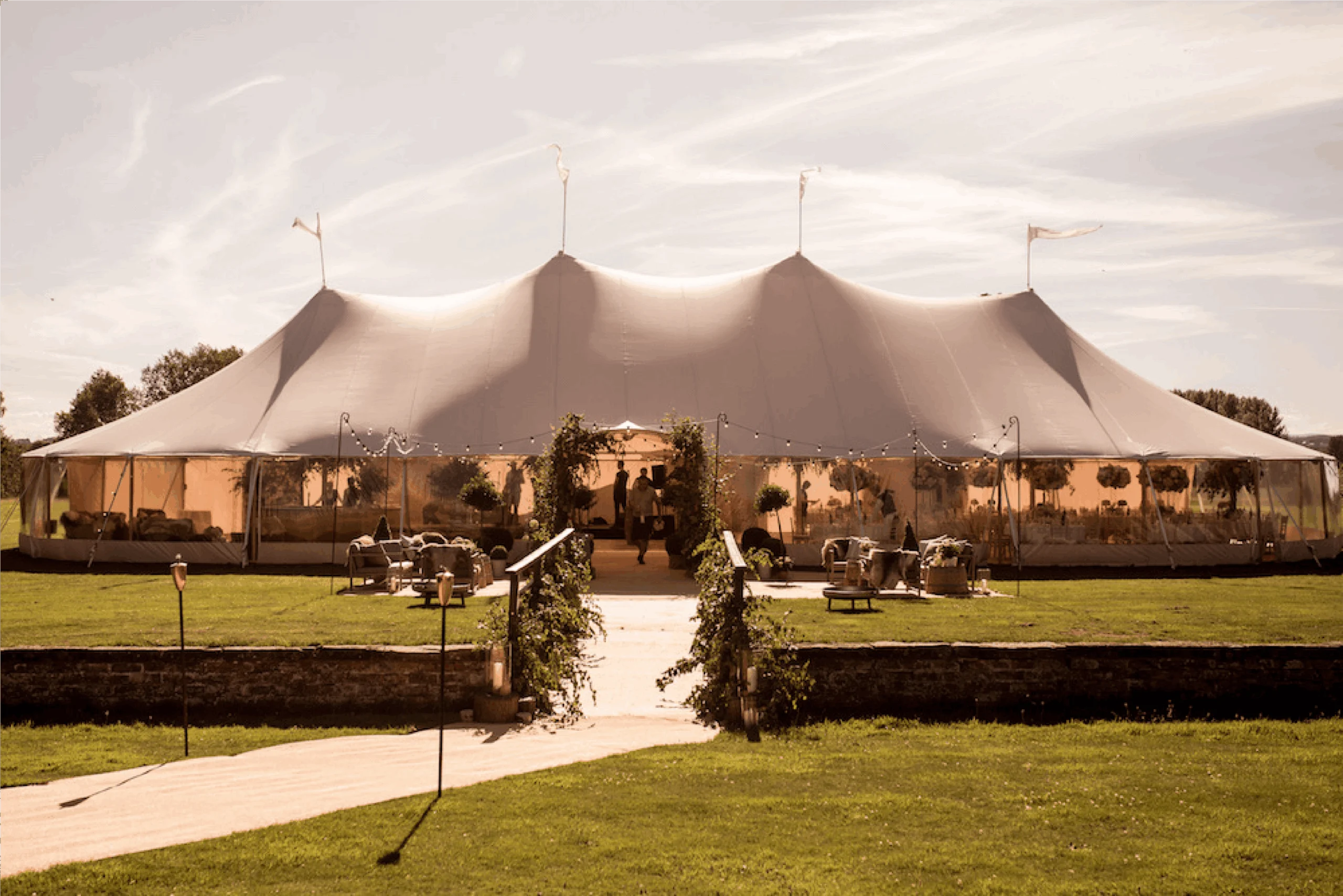 Wedding marquee with a walkway across the lawn
