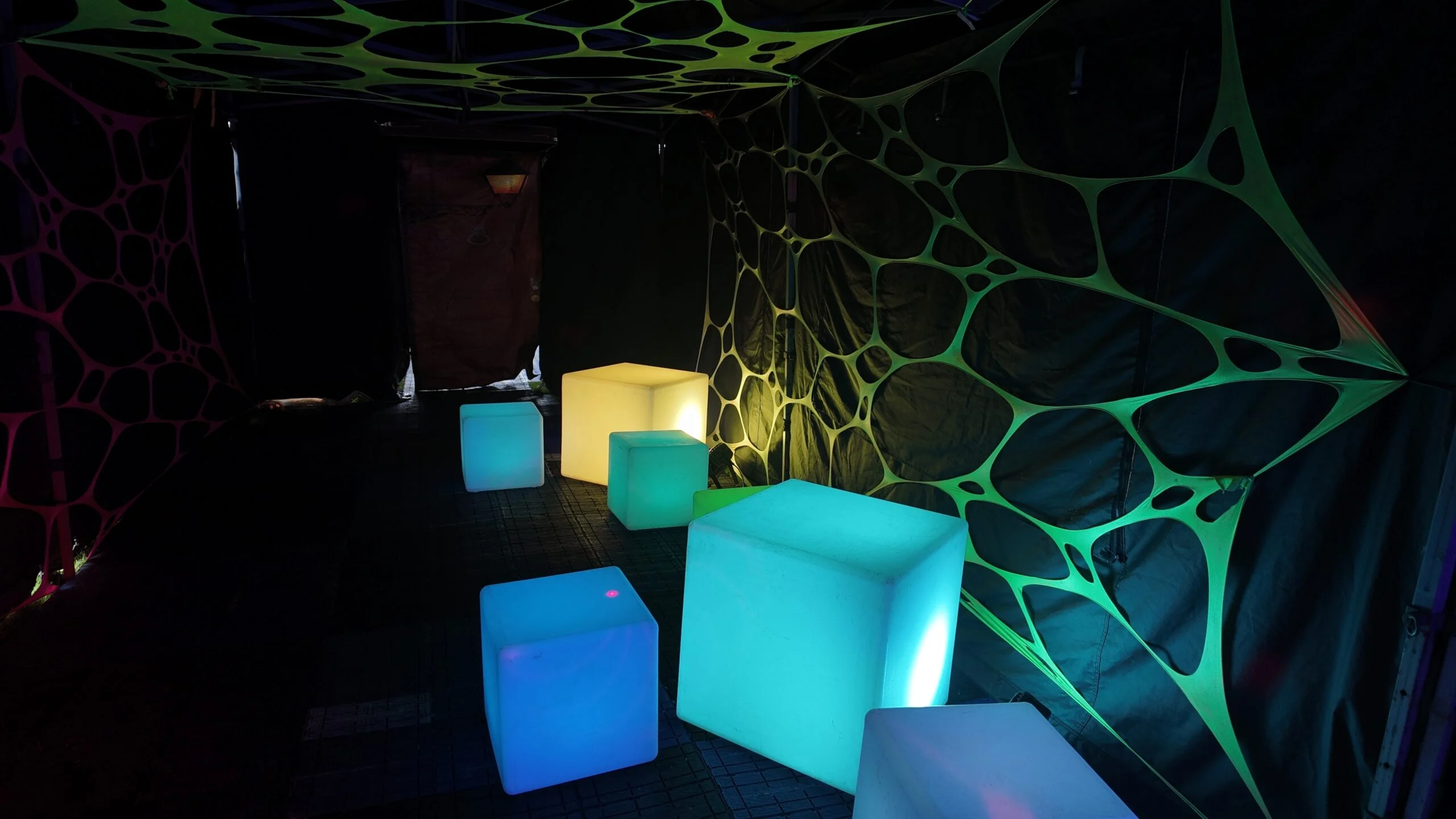 Illuminated cube seats inside a party tent — example for events in Alderley Edge